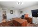 Home office features a large desk, a printer, and views into another room at 1016 Silver Lake Ct, Greenwood, IN 46142