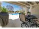 Covered patio with views of the pool, basketball hoop and the lake in the background at 1016 Silver Lake Ct, Greenwood, IN 46142