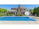 Beautiful backyard pool featuring a basketball hoop, an outdoor kitchen and professionally manicured landscaping at 1016 Silver Lake Ct, Greenwood, IN 46142