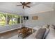 Bright sunroom with vaulted ceiling, brick walls and large windows at 1016 Silver Lake Ct, Greenwood, IN 46142