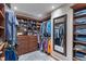 Spacious walk-in closet with custom shelves, drawers, and ample storage space at 1016 Silver Lake Ct, Greenwood, IN 46142