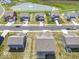 Aerial view of a neighborhood with well-maintained homes and a community pond at 10524 Broadford St, Indianapolis, IN 46239