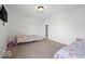 Bright bedroom with two twin beds, neutral carpet, and fresh paint, ready for personalization at 10524 Broadford St, Indianapolis, IN 46239