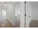 Bright hallway showcasing access to multiple rooms, each featuring fresh paint and clean carpeting at 10524 Broadford St, Indianapolis, IN 46239
