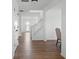 Inviting hallway with wood floors, white trim, and natural light streaming in at 10524 Broadford St, Indianapolis, IN 46239