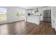 Open concept kitchen featuring a white island, modern appliances, and light-filled windows, perfect for entertaining at 10524 Broadford St, Indianapolis, IN 46239
