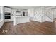Modern kitchen with white cabinets, stainless steel appliances, and a large center island at 10524 Broadford St, Indianapolis, IN 46239