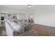 Open-concept living room and kitchen with hardwood floors and modern finishes at 10524 Broadford St, Indianapolis, IN 46239