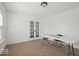 Bright office space with french doors, neutral carpet, and large window at 10524 Broadford St, Indianapolis, IN 46239