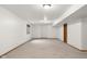 Unfinished basement with neutral carpet and white walls offers a blank canvas ready for personalization at 1121 Retford Ct, Greenwood, IN 46143