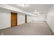Neutral carpet and white walls in unfinished basement provide a blank canvas for personalization at 1121 Retford Ct, Greenwood, IN 46143