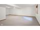 Unfinished basement with neutral carpet and white walls offers a blank canvas ready for personalization at 1121 Retford Ct, Greenwood, IN 46143