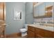 Cozy bathroom with wood cabinets, marble countertops and tile flooring at 1121 Retford Ct, Greenwood, IN 46143