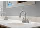 Bathroom vanity featuring double sinks, chrome fixtures, and a granite countertop at 1121 Retford Ct, Greenwood, IN 46143