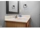 Bathroom featuring a light countertop, wooden cabinets, and chrome faucet at 1121 Retford Ct, Greenwood, IN 46143