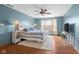 Cozy bedroom with a fan and hardwood floors offers a restful retreat at 1121 Retford Ct, Greenwood, IN 46143