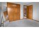 Bedroom boasts a full-length mirror and wood closet with bi-fold doors at 1121 Retford Ct, Greenwood, IN 46143