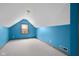 Attic bedroom featuring teal walls, neutral carpet, a dormer window, and angled ceilings at 1121 Retford Ct, Greenwood, IN 46143