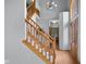 Bright foyer with hardwood floors, staircase with wooden banister, and decorative chandelier at 1121 Retford Ct, Greenwood, IN 46143