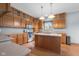 Spacious eat-in kitchen featuring wooden cabinets, stainless steel appliances, and countertop space at 1121 Retford Ct, Greenwood, IN 46143