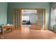 Warm room featuring french doors leading to another room with sofa and large windows at 1121 Retford Ct, Greenwood, IN 46143