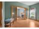 Warm room featuring french doors leading to another room with fireplace and large windows at 1121 Retford Ct, Greenwood, IN 46143