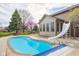 Backyard pool featuring a slide, and mature landscaping in this suburban home at 1121 Retford Ct, Greenwood, IN 46143