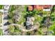 A birds-eye view reveals lush gardens around the home and driveway at 11625 Rolling Springs Dr, Carmel, IN 46033