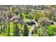 An aerial view features a beautiful home surrounded by lush landscaping at 11625 Rolling Springs Dr, Carmel, IN 46033