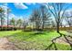 The backyard has a large lawn and a privacy fence at 11625 Rolling Springs Dr, Carmel, IN 46033