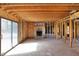 Unfinished basement space featuring exposed wood framing and a brick fireplace at 11625 Rolling Springs Dr, Carmel, IN 46033