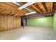 An unfinished basement offering ample space, wooden wall paneling and exposed overhead piping ready for customization at 11625 Rolling Springs Dr, Carmel, IN 46033
