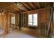 Unfinished basement featuring exposed beams, framing, and window to the exterior at 11625 Rolling Springs Dr, Carmel, IN 46033