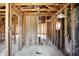 Exposed interior framing showcasing potential for open floor plan and unique window design at 11625 Rolling Springs Dr, Carmel, IN 46033