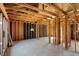 Spacious interior with exposed wooden framing, ready for customization at 11625 Rolling Springs Dr, Carmel, IN 46033