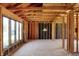 Unfinished interior framing featuring large windows, abundant light, and custom design at 11625 Rolling Springs Dr, Carmel, IN 46033