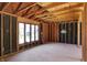 Interior framing showcases large windows, natural light, and design flexibility at 11625 Rolling Springs Dr, Carmel, IN 46033
