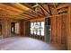 Open interior with exposed wood framing, and the potential for a staircase at 11625 Rolling Springs Dr, Carmel, IN 46033