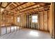Open-concept interior with exposed framing, and natural light through multiple windows at 11625 Rolling Springs Dr, Carmel, IN 46033