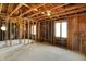 Open unfinished interior with exposed framework and windows offering potential for remodeling and customization at 11625 Rolling Springs Dr, Carmel, IN 46033