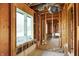 Bright unfinished interior with window views, highlighting exposed framing for a custom renovation opportunity at 11625 Rolling Springs Dr, Carmel, IN 46033