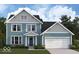 Charming two-story home showcases light blue siding, a two-car garage, and a welcoming covered porch entrance at 12004 Crestwater Ct, Fishers, IN 46037