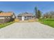 Inviting backyard showcasing a newly constructed wooden deck and fresh gravel, ideal for relaxation and outdoor enjoyment at 1217 W 6Th St, Anderson, IN 46016