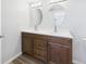 Bathroom vanity has double sinks, wood cabinets, and modern faucets at 1217 W 6Th St, Anderson, IN 46016