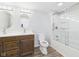 Bathroom boasts double sink vanity, toilet, and shower with glass door at 1217 W 6Th St, Anderson, IN 46016