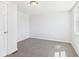 Carpeted neutral bedroom has a bright window for natural light at 1217 W 6Th St, Anderson, IN 46016