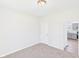 Bright bedroom features neutral carpet, paint, and white door at 1217 W 6Th St, Anderson, IN 46016