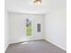 Neutral bedroom featuring carpet, light walls, a window with exterior view, and light fixture at 1217 W 6Th St, Anderson, IN 46016