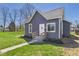 Attractive home with a quaint front entrance, complemented by a well-maintained lawn and fresh landscaping at 1217 W 6Th St, Anderson, IN 46016