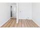 Hallway has durable vinyl plank flooring and leads to laundry hookups at 1217 W 6Th St, Anderson, IN 46016